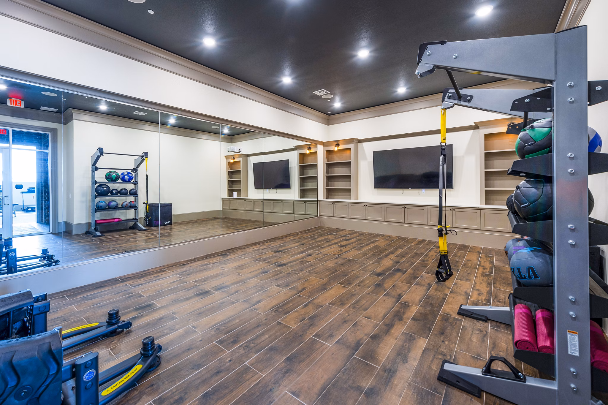 Modern fitness center with state-of-the-art equipment at Hardy Yards Apartment Homes, offering residents a premier workout experience