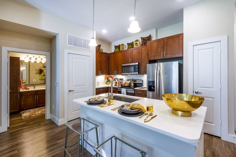 Modern kitchen with stainless steel appliances in Hardy Yards Apartment Homes, luxury apartments by Greystar in a vibrant urban setting