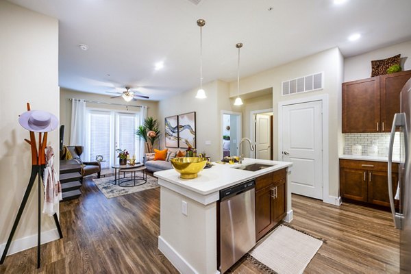 Modern kitchen with stainless steel appliances at Hardy Yards Apartment Homes