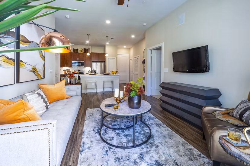 Spacious living room with modern furnishings at Hardy Yards Apartment Homes