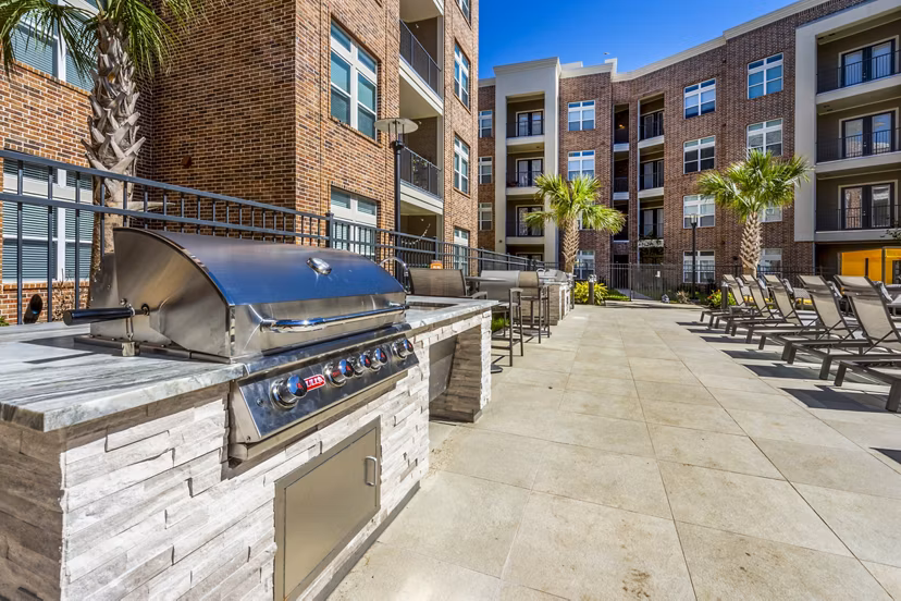 Outdoor grill area with modern seating at Hardy Yards Apartment Homes