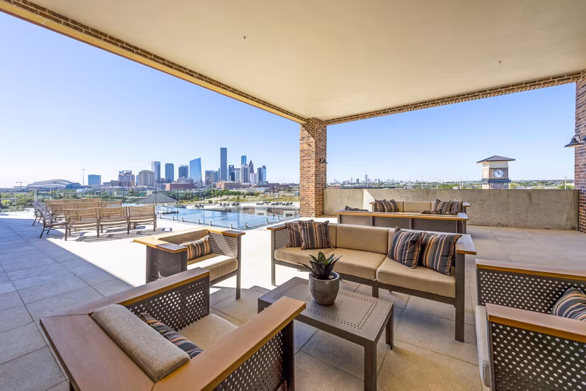 Patio with modern seating at Hardy Yards Apartment Homes, offering beautiful outdoor space adjacent to the luxury apartments