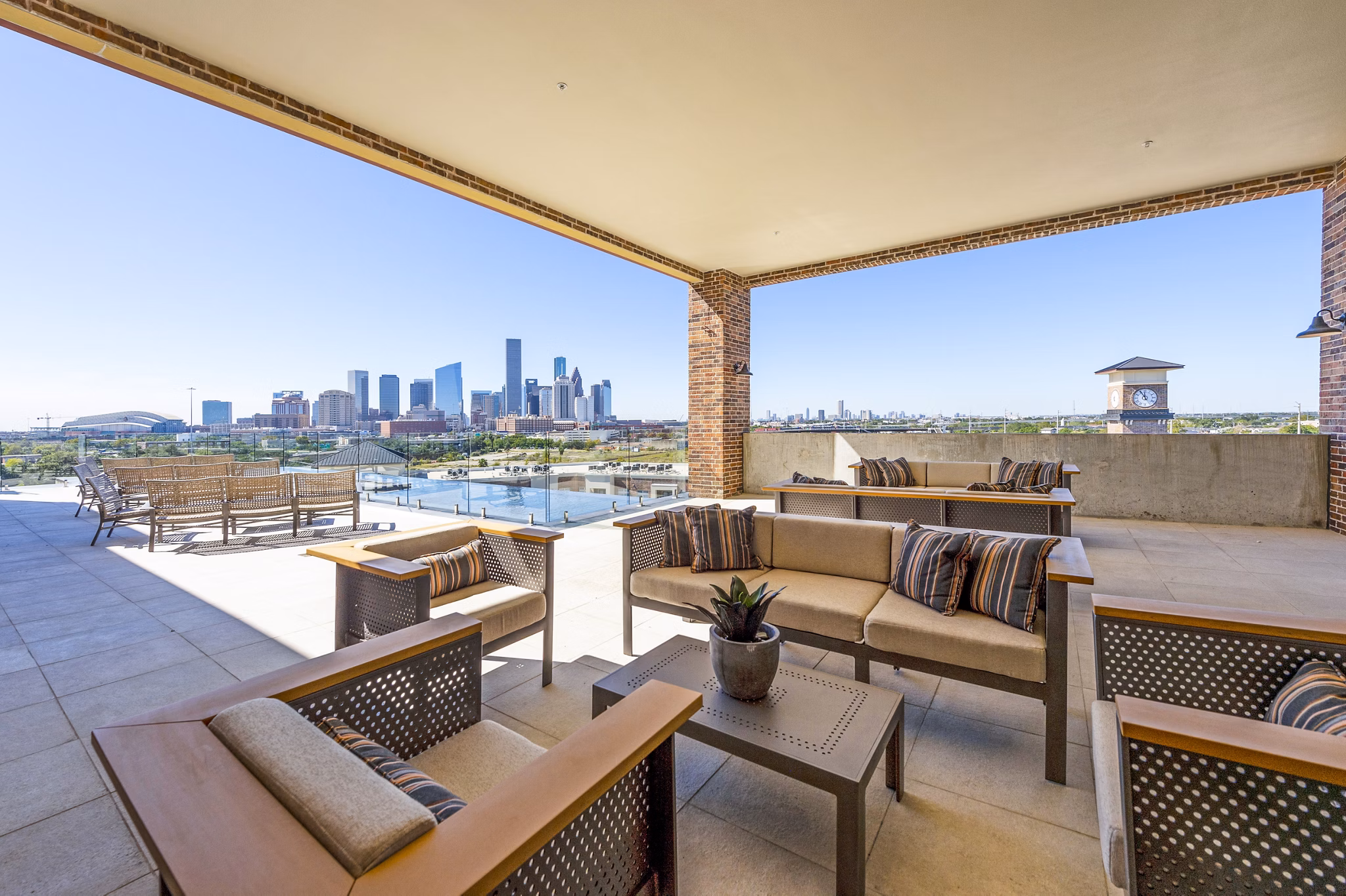 Patio with modern seating at Hardy Yards Apartment Homes, offering beautiful outdoor space adjacent to the luxury apartments
