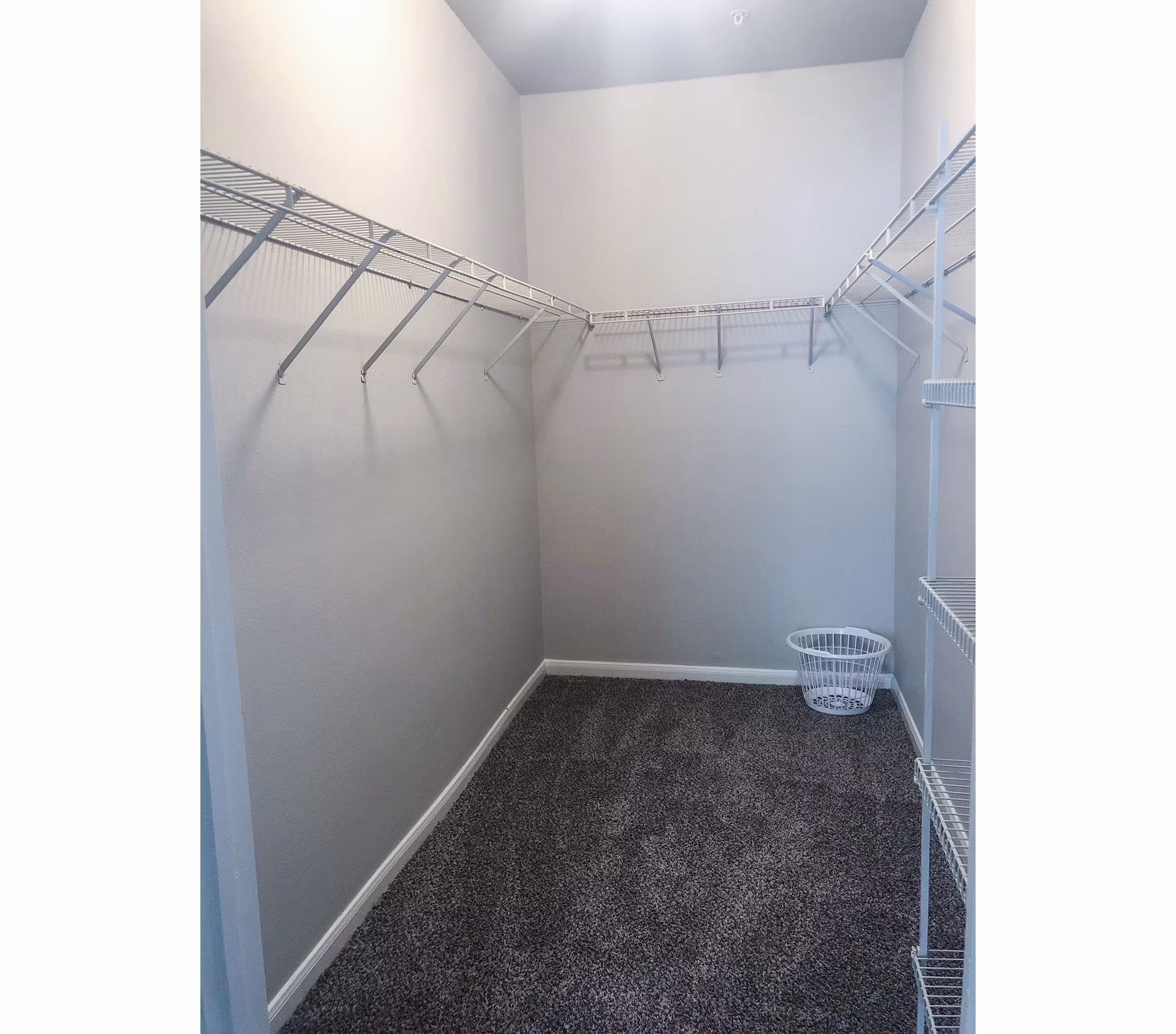 Organized bedroom closet with ample shelving at Breakers at Windmill Lakes Apartments