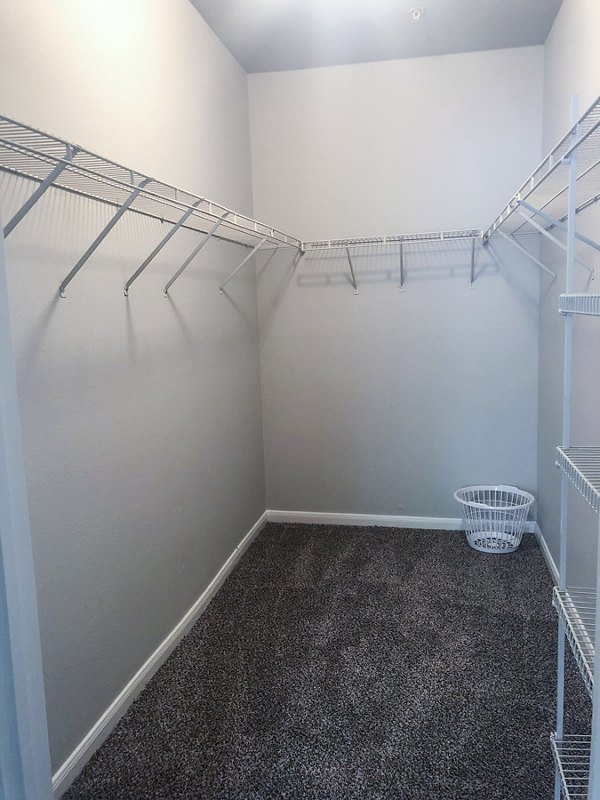 Organized bedroom closet with ample shelving at Breakers at Windmill Lakes Apartments