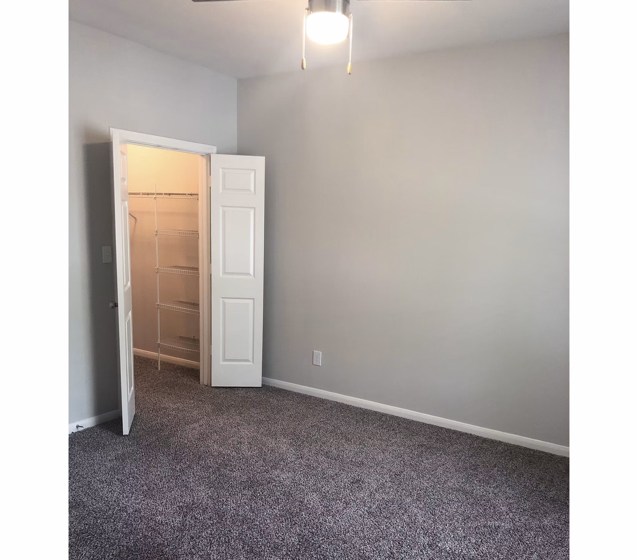 Stylish bedroom with contemporary decor at Breakers at Windmill Lakes Apartments