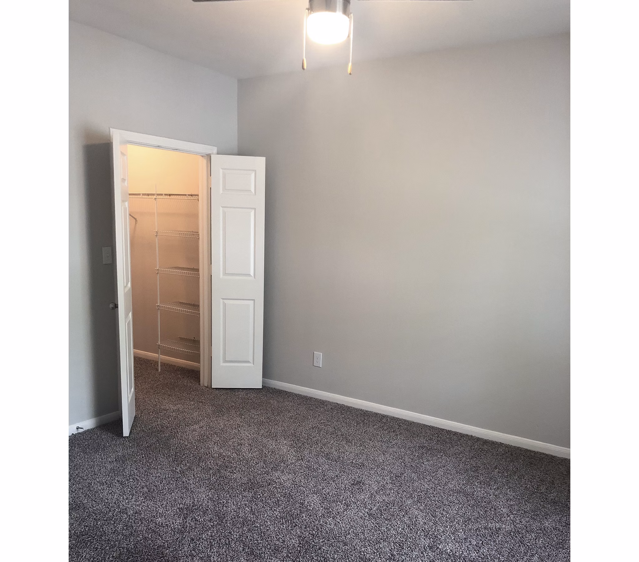 Stylish bedroom with contemporary decor at Breakers at Windmill Lakes Apartments