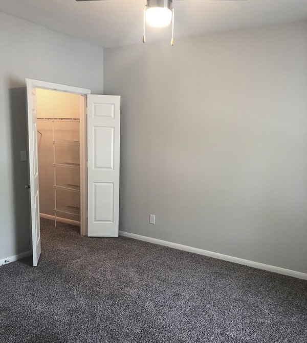Stylish bedroom with contemporary decor at Breakers at Windmill Lakes Apartments