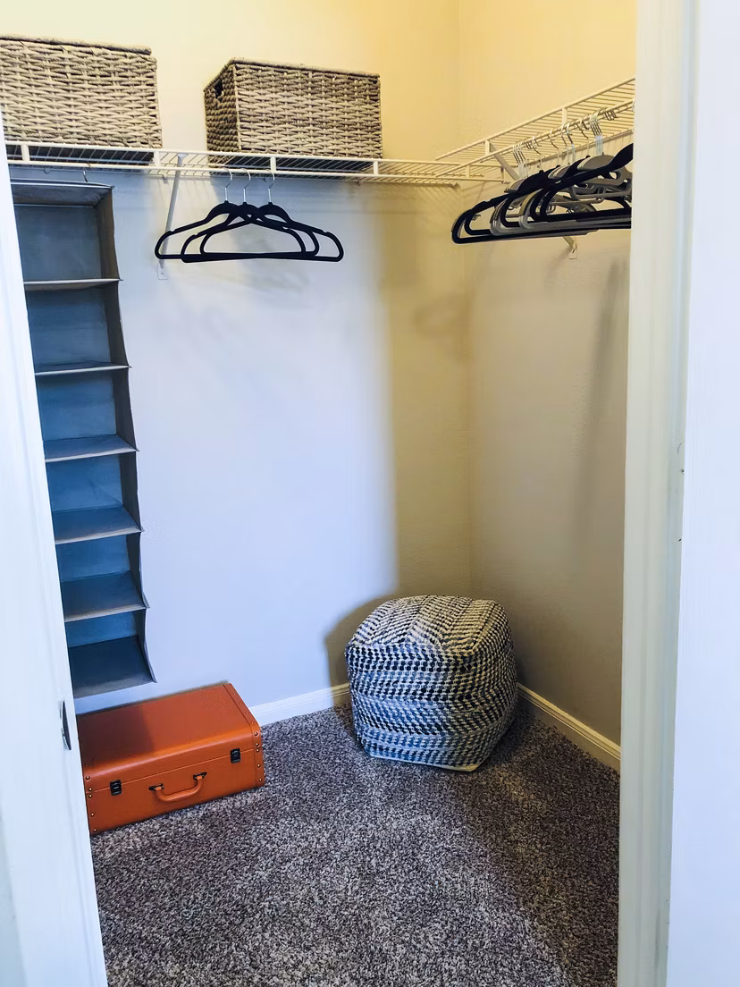 Bedroom closet featuring custom shelving at Breakers at Windmill Lakes Apartments