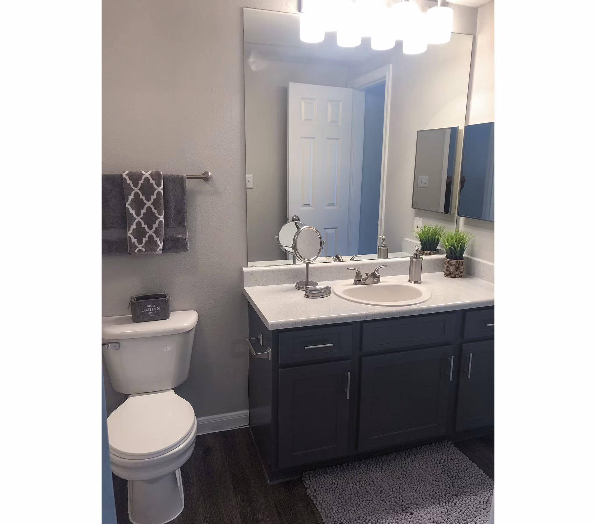 Modern bathroom with sleek fixtures in Breakers at Windmill Lakes Apartments, showcasing elegance and functionality