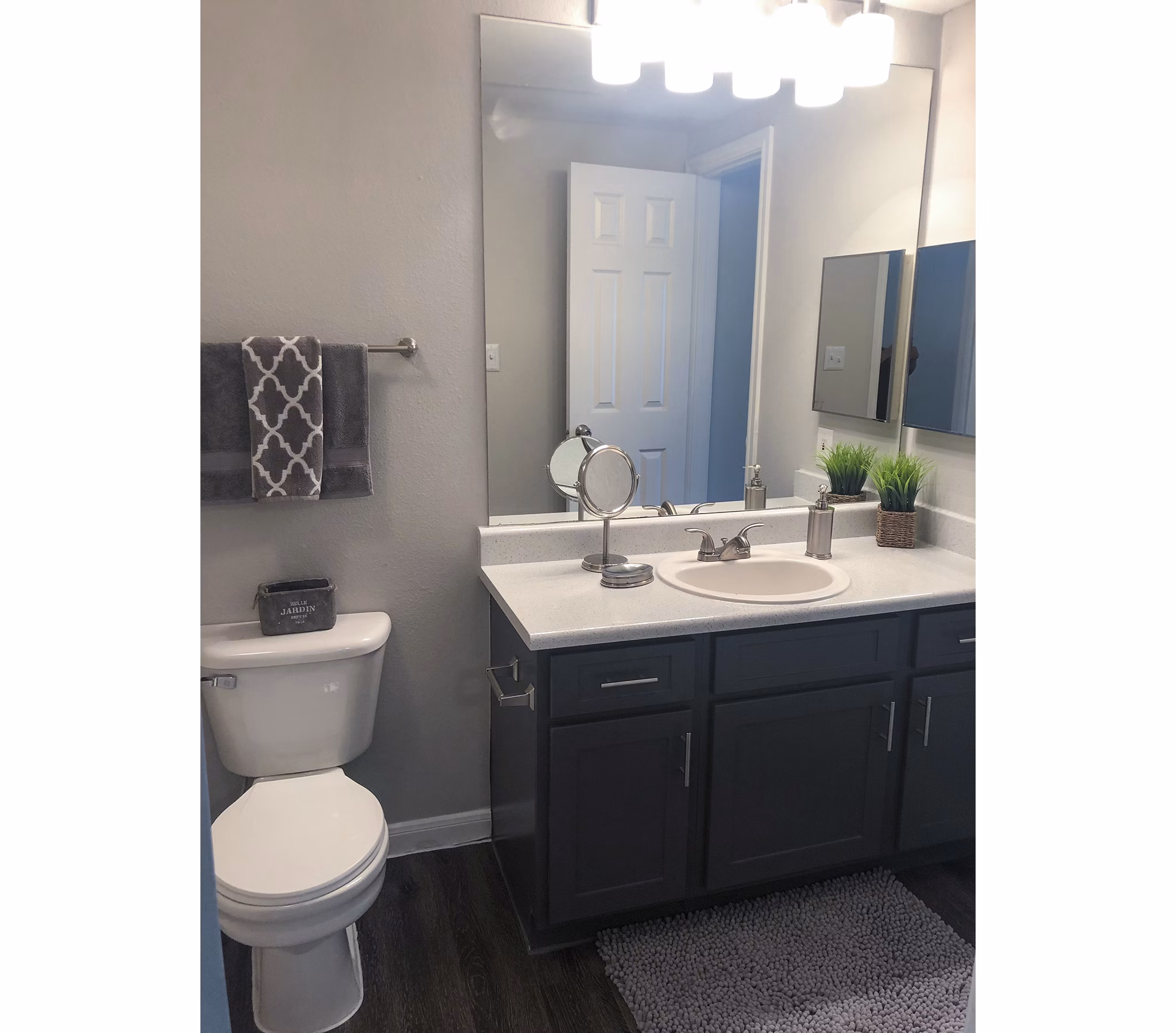 Modern bathroom with sleek fixtures in Breakers at Windmill Lakes Apartments, showcasing elegance and functionality