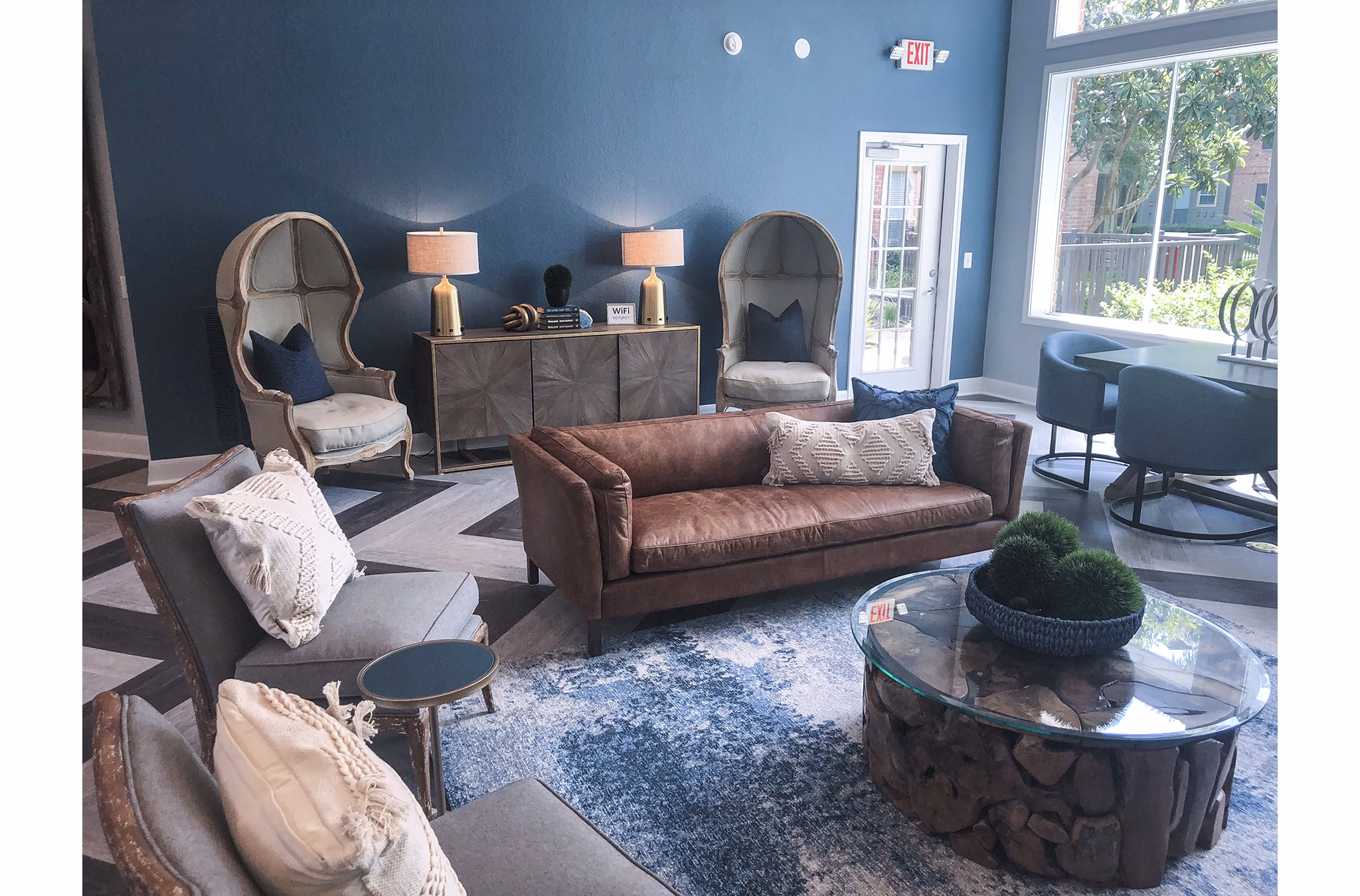 Clubhouse featuring modern design and spacious seating at Breakers at Windmill Lakes Apartments