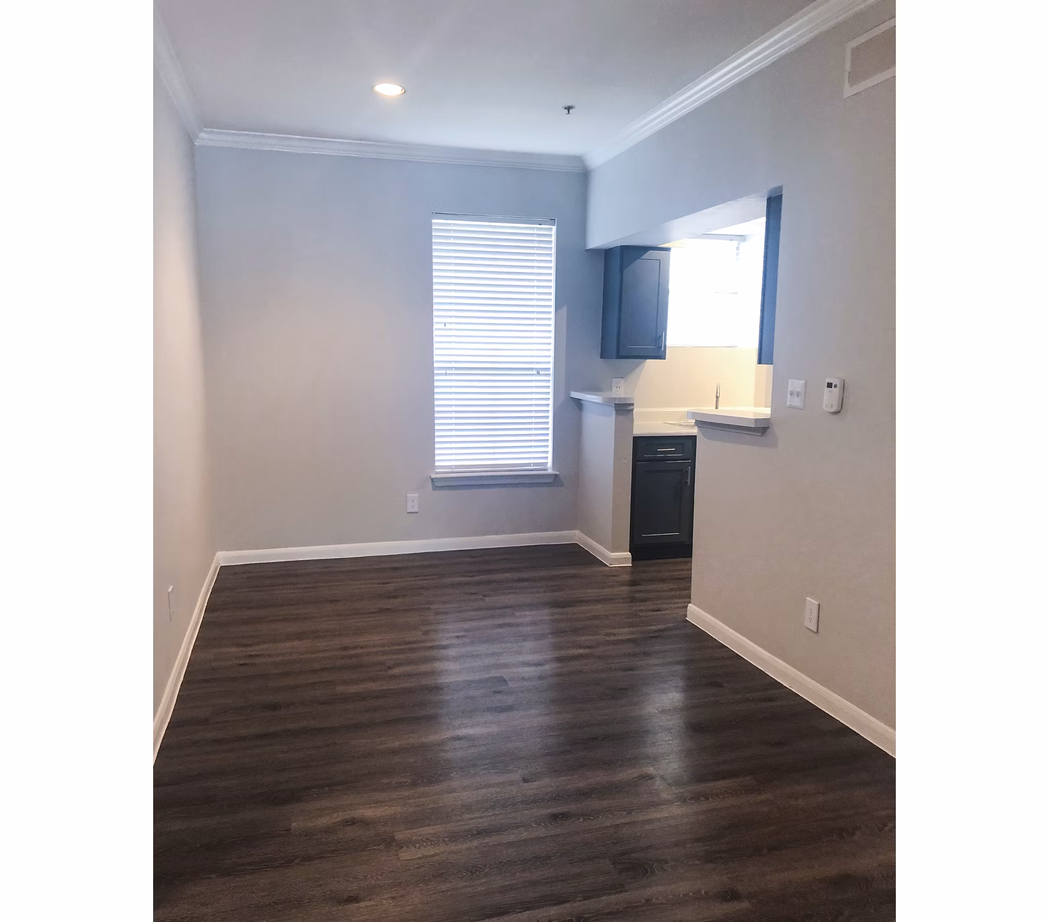Elegant dining room with contemporary furnishings at Breakers at Windmill Lakes Apartments