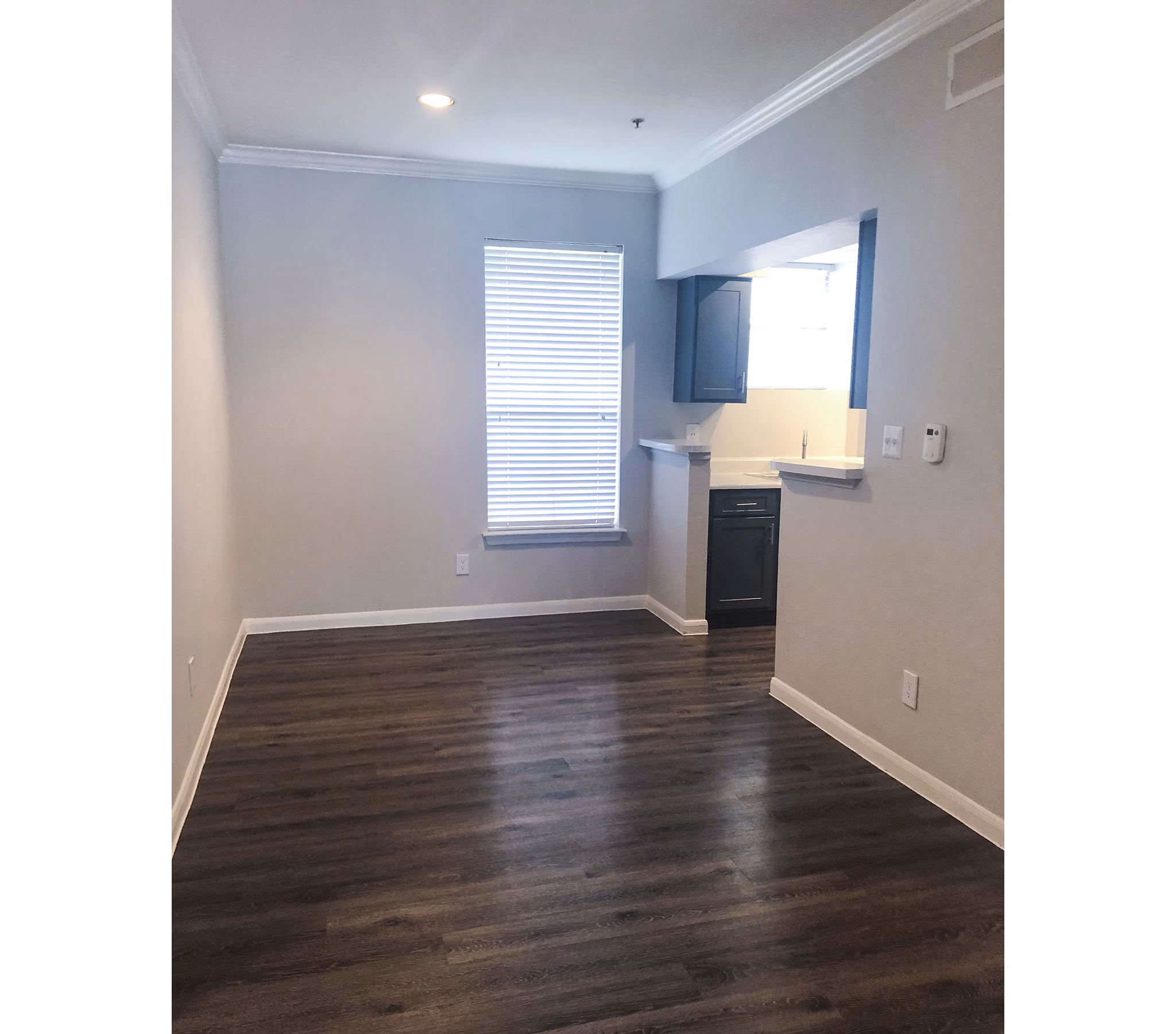 Elegant dining room with contemporary furnishings at Breakers at Windmill Lakes Apartments
