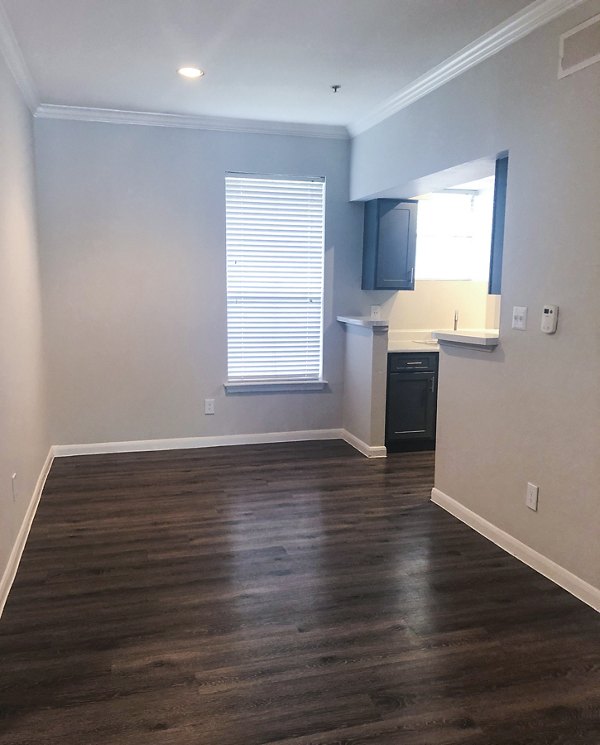 Elegant dining room with contemporary furnishings at Breakers at Windmill Lakes Apartments
