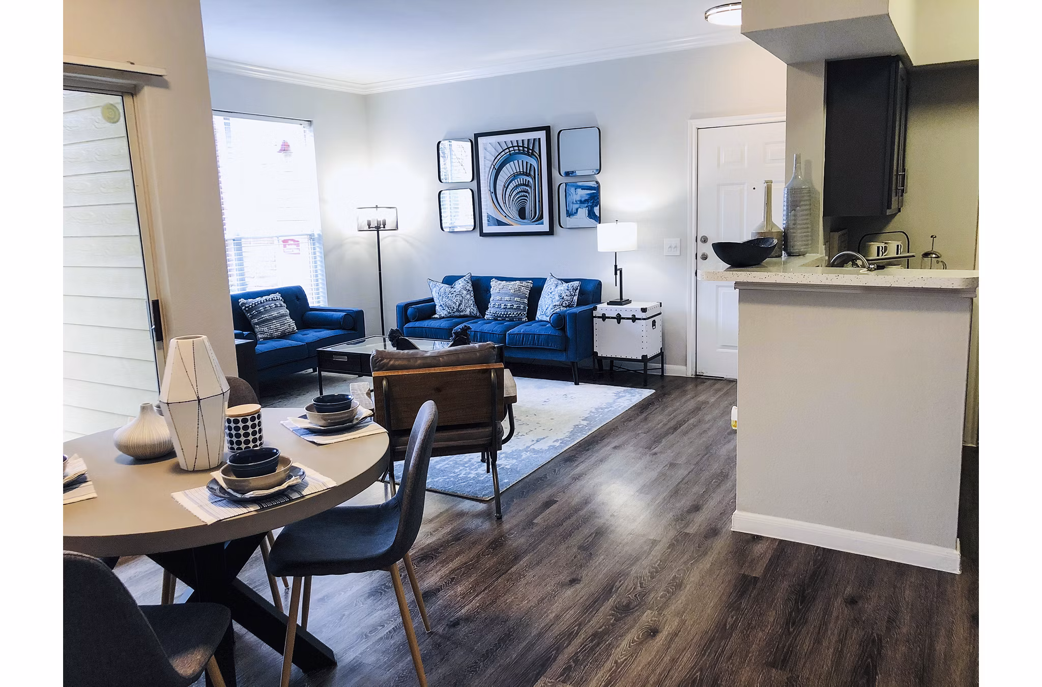 Dining room with modern decor and ample natural light in Breakers at Windmill Lakes Apartments