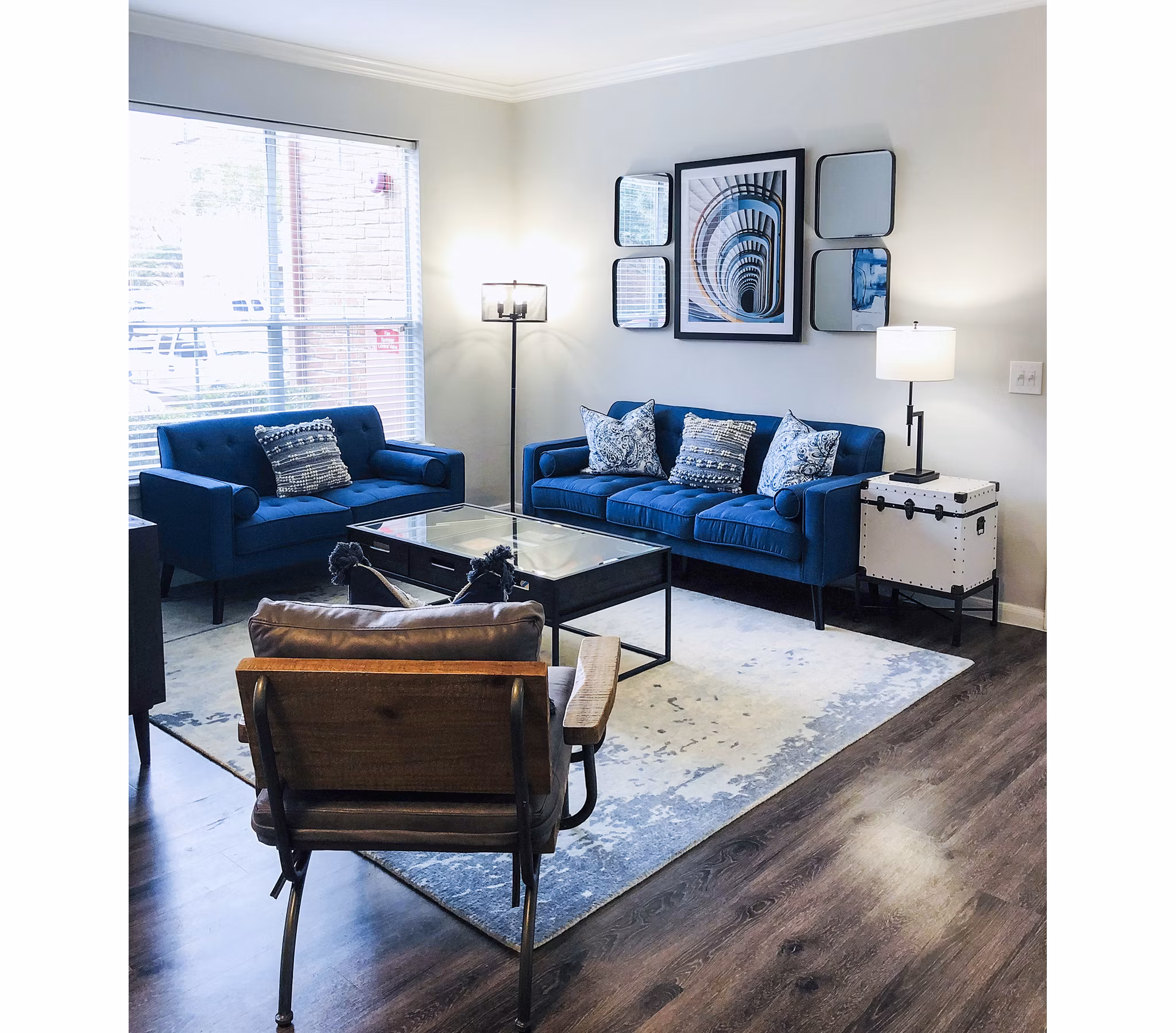Spacious living room with elegant decor in Breakers at Windmill Lakes Apartments