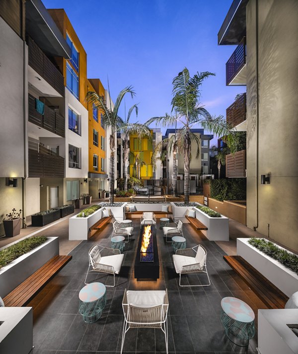 Cozy fire pit on a stylish patio at Alaya Hollywood Apartments, perfect for outdoor socializing and relaxation