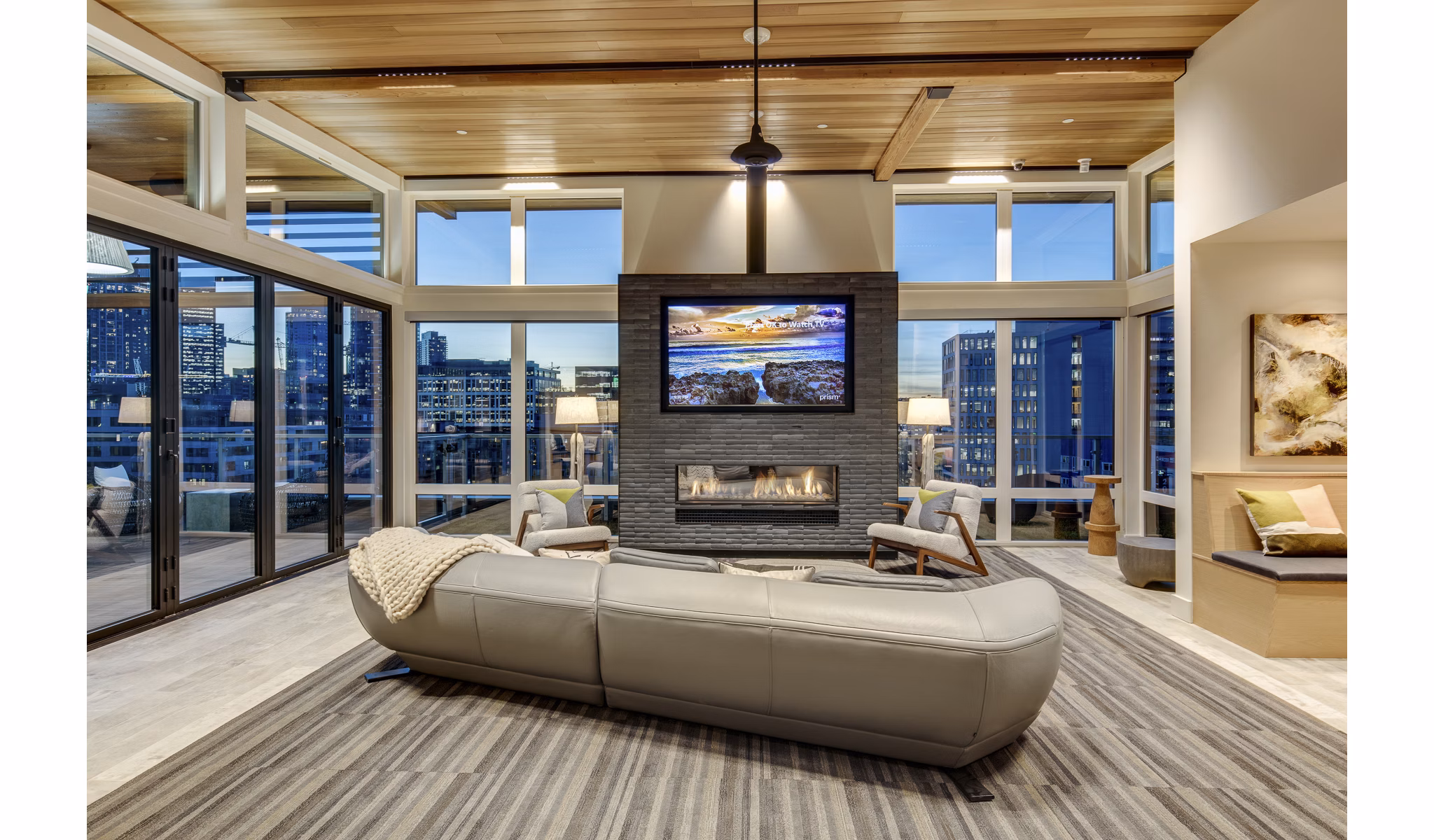 Modern clubhouse with stylish seating and game tables at Sitka Apartments, offering luxury amenities in Seattle's vibrant community