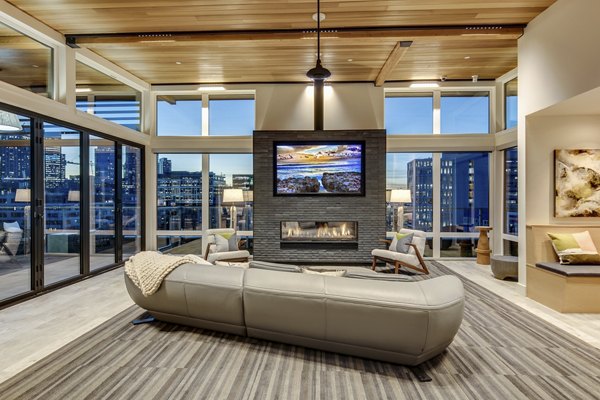 Modern clubhouse with stylish seating and game tables at Sitka Apartments, offering luxury amenities in Seattle's vibrant community