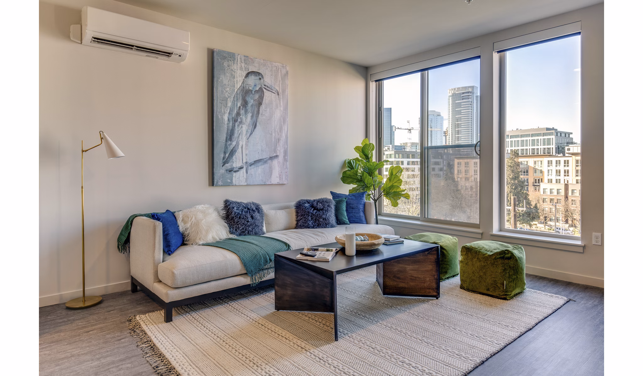 Living room with modern furnishings and natural light in Sitka Apartments
