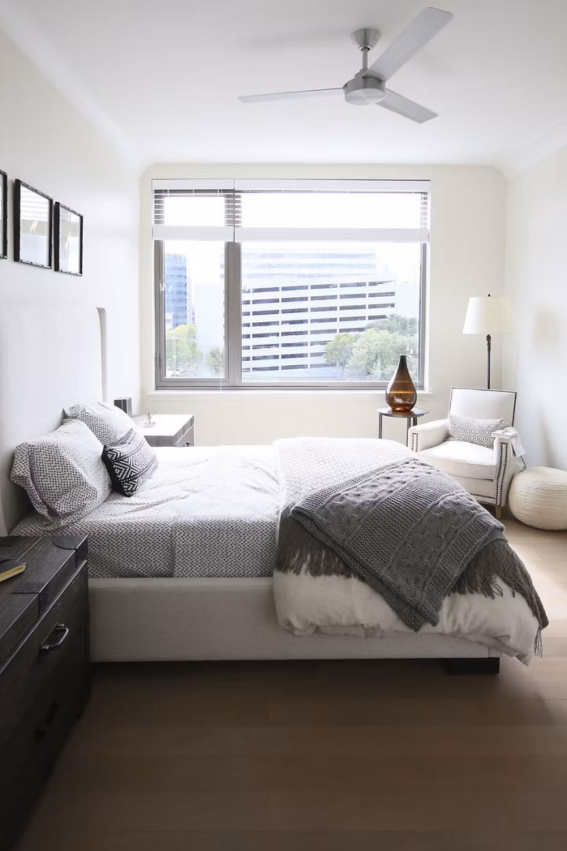 Elegant bedroom with chic furnishings at Grey House Apartments