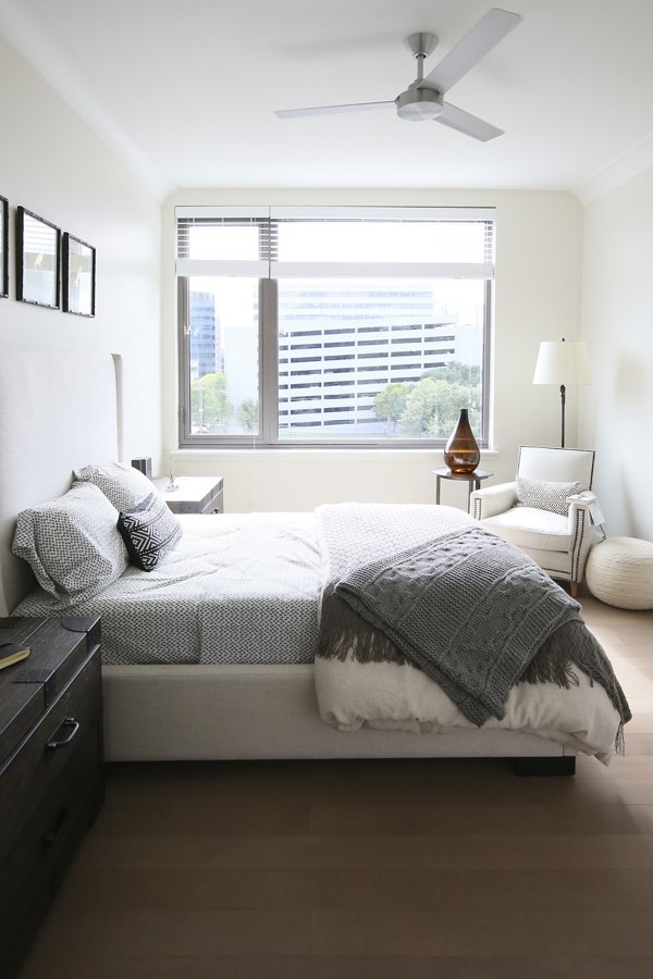 Elegant bedroom with chic furnishings at Grey House Apartments