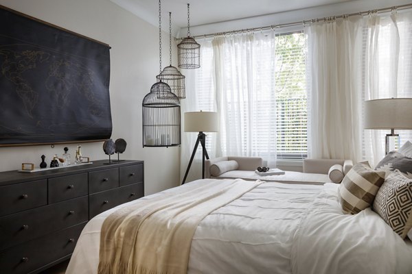 Elegant bedroom with modern decor at Grey House Apartments