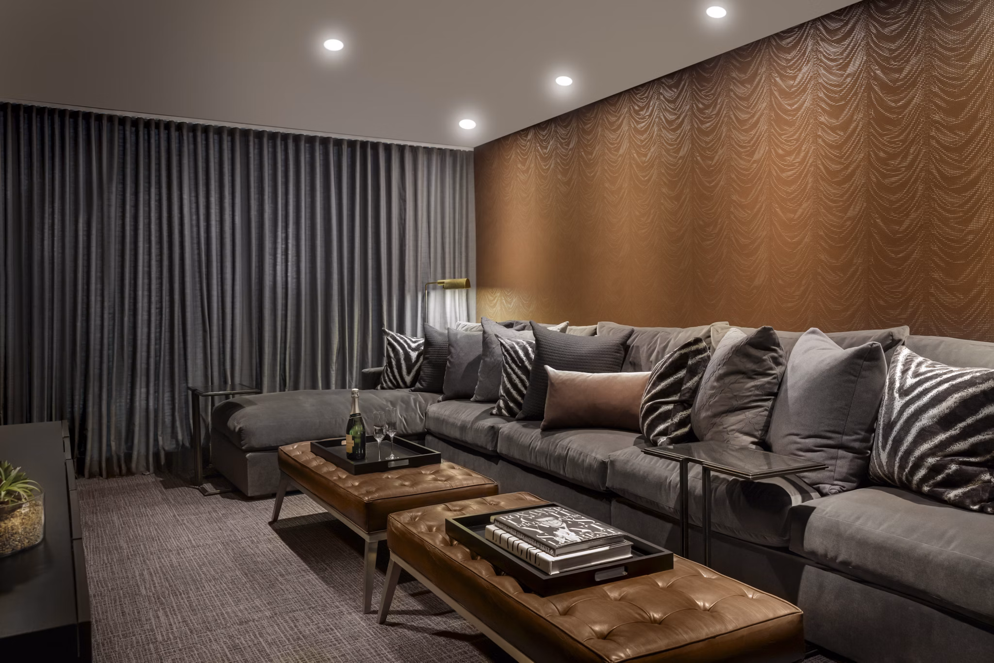 Clubhouse with modern decor at Grey House Apartments featuring seating and entertainment spaces