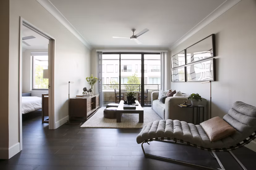 Spacious living room with modern decor in Grey House Apartments offering a luxurious living experience