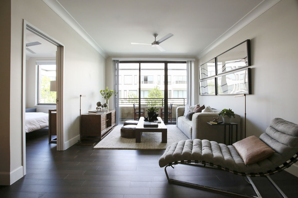 Spacious living room with modern decor in Grey House Apartments offering a luxurious living experience