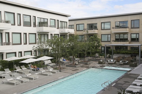 Luxury pool with sleek design at Grey House Apartments, offering a relaxing amenity for residents seeking premier living experience