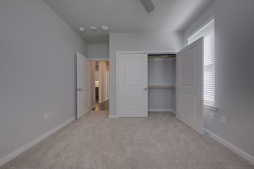 Modern bedroom with stylish decor at Tacara Westpointe Village Apartments