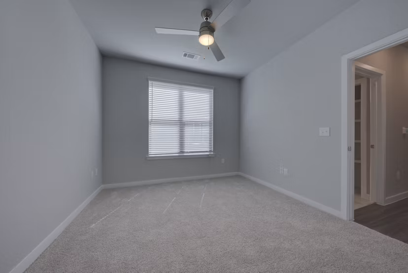 Spacious bedroom with modern decor at Tacara Westpointe Village Apartments