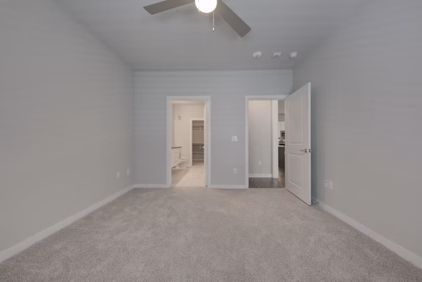 Modern bedroom with elegant decor at Tacara Westpointe Village Apartments