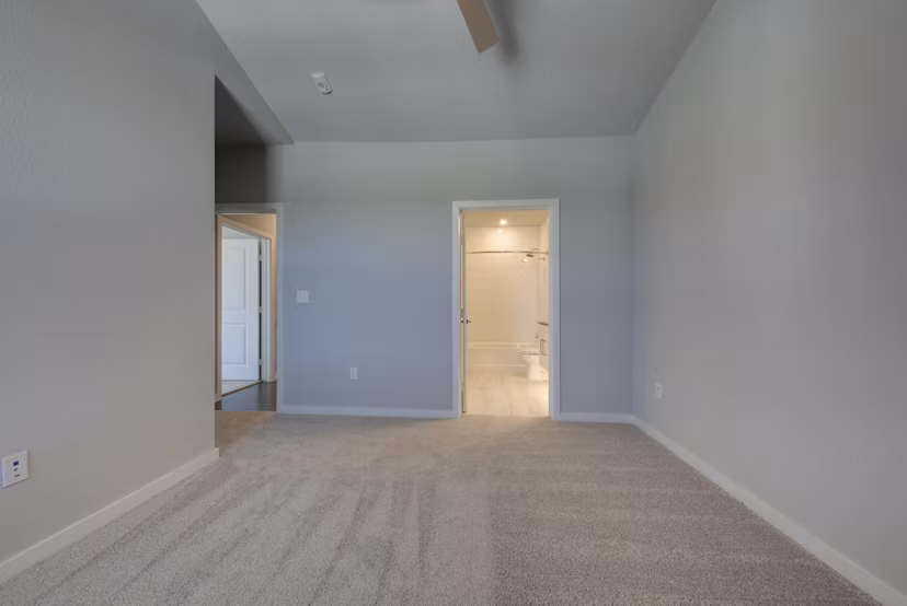 Modern bedroom with sleek decor at Tacara Westpointe Village Apartments