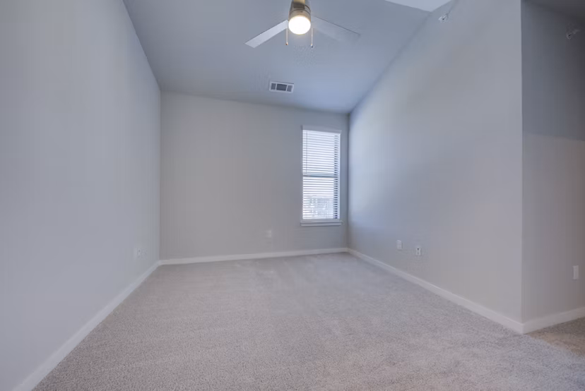 Bedroom featuring elegant decor and plush bedding at Tacara Westpointe Village Apartments