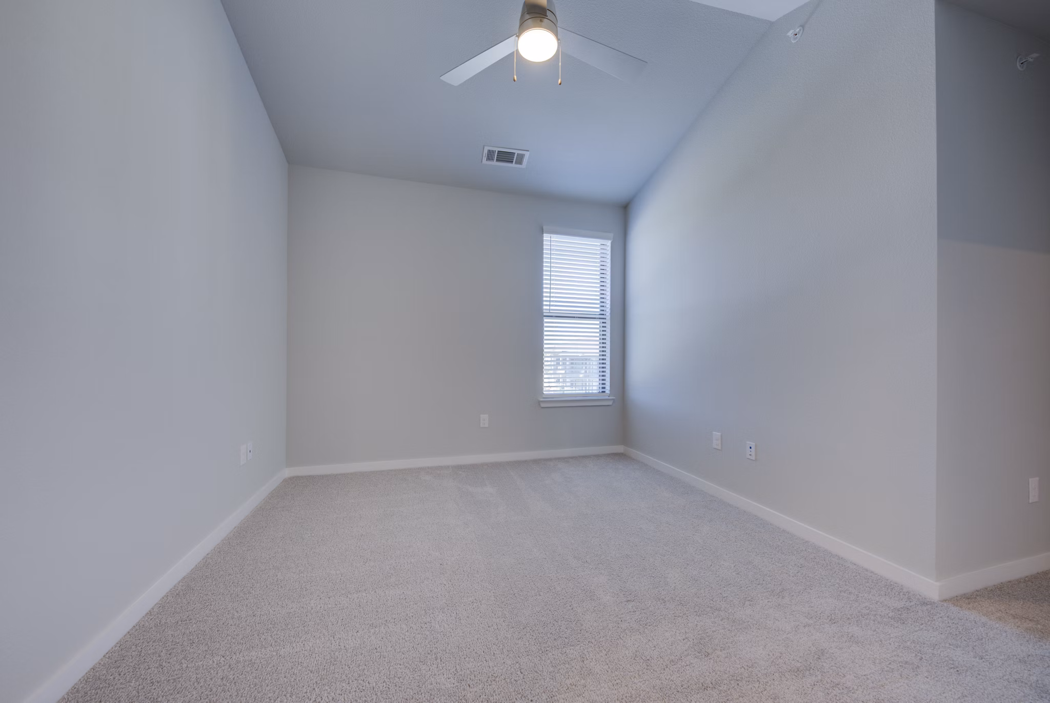 Bedroom featuring elegant decor and plush bedding at Tacara Westpointe Village Apartments