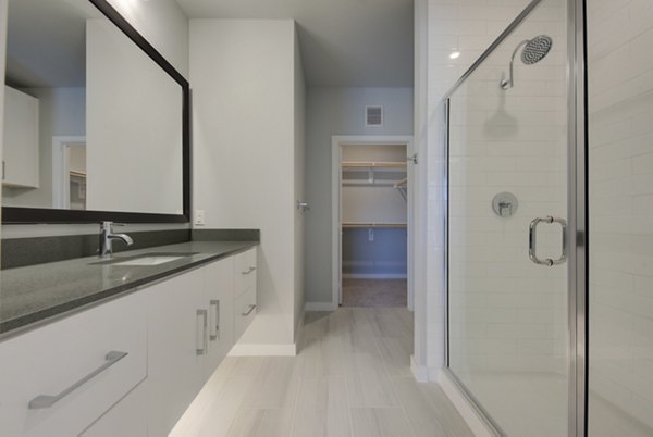 Bathroom featuring modern fixtures and elegant vanity at Tacara Westpointe Village Apartments