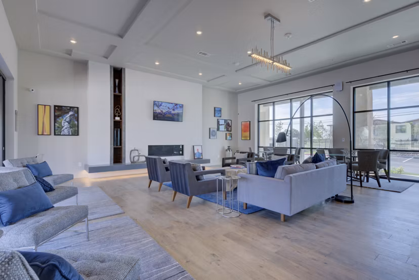 Clubhouse with elegant design and seating area at Tacara Westpointe Village Apartments luxury community in Texas