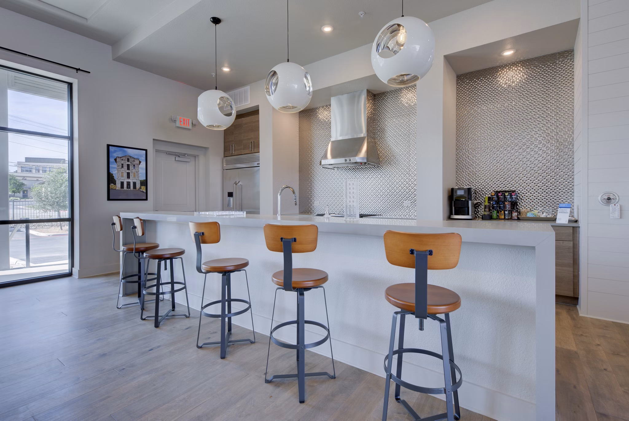 Clubhouse at Tacara Westpointe Village Apartments featuring modern design and spacious seating areas in a vibrant community setting