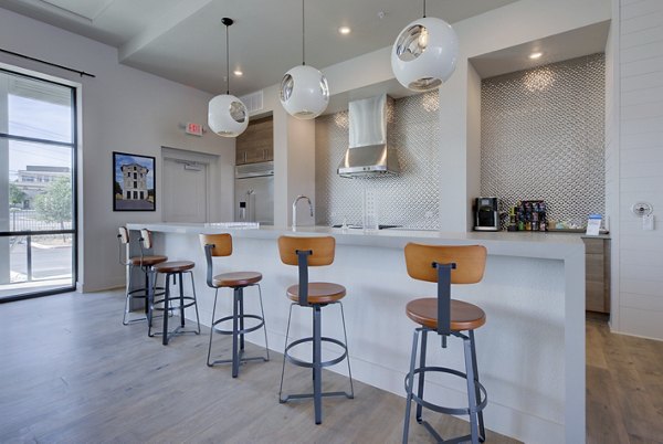 Clubhouse at Tacara Westpointe Village Apartments featuring modern design and spacious seating areas in a vibrant community setting