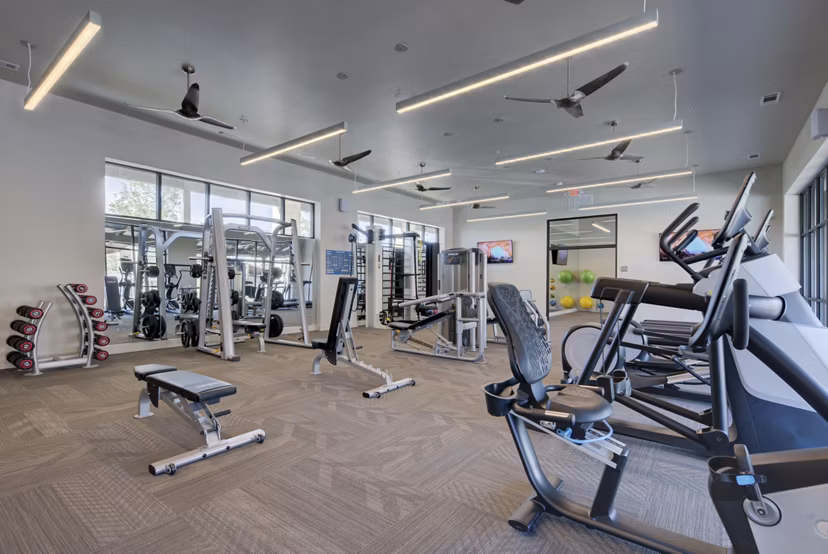 State-of-the-art fitness center featuring modern equipment at Tacara Westpointe Village Apartments