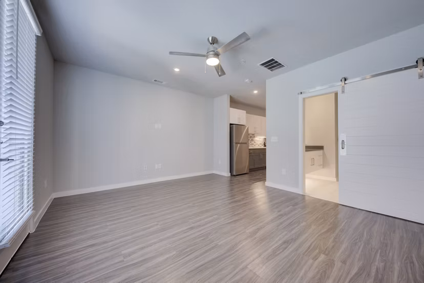 Modern kitchen with stainless steel appliances in Tacara Westpointe Village Apartments