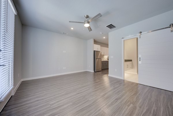 Modern kitchen with stainless steel appliances in Tacara Westpointe Village Apartments