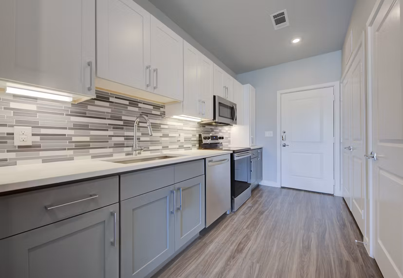 Modern kitchen featuring stainless steel appliances in Tacara Westpointe Village Apartments