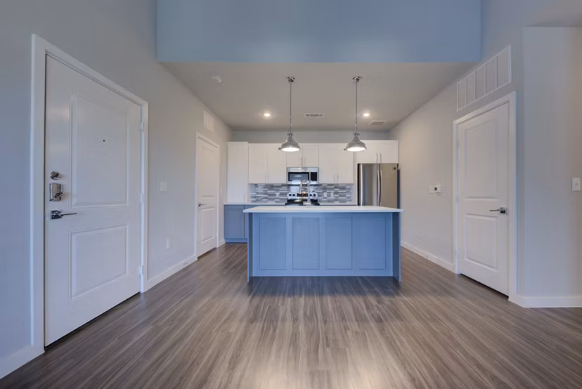 Modern kitchen with stainless steel appliances at Tacara Westpointe Village Apartments