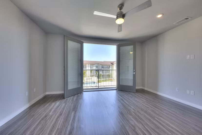 Cozy living room with modern decor at Tacara Westpointe Village Apartments, featuring luxurious seating and natural lighting