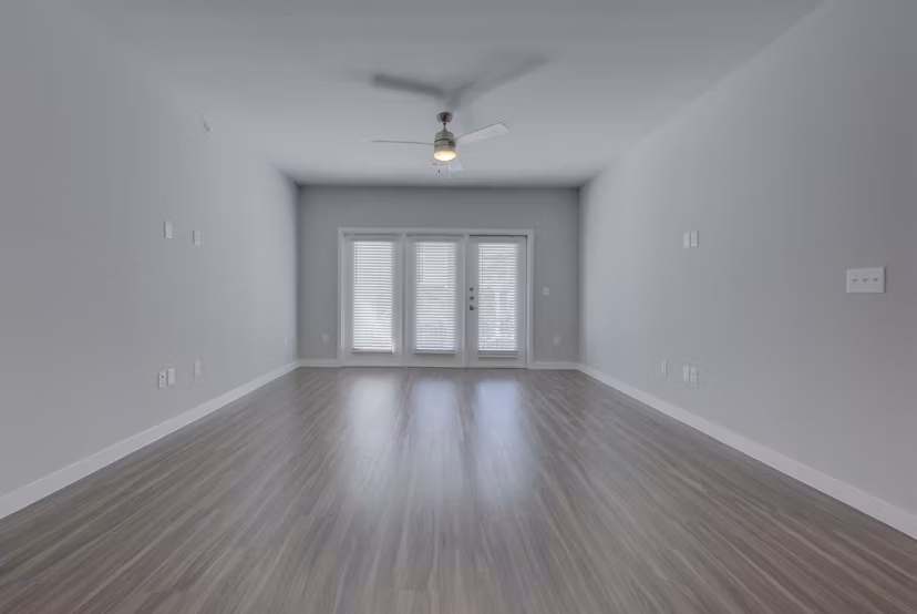 Spacious living room with modern decor at Tacara Westpointe Village Apartments