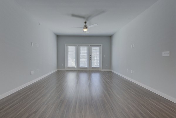 Spacious living room with modern decor at Tacara Westpointe Village Apartments